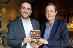 Jewish Agency Chairman Isaac "Buji" Herzog receives his copy of Rabbi Dunner's book Mavericks, Mystics & False Messiahs, at his hotel in Los Angeles, December 2, 2018